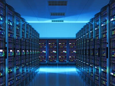 Racks of servers in a blue-lit data hall