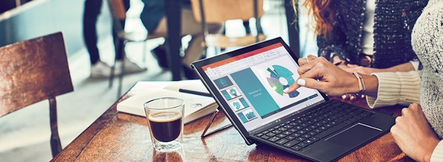 Person interacting with charts on a touch screen device